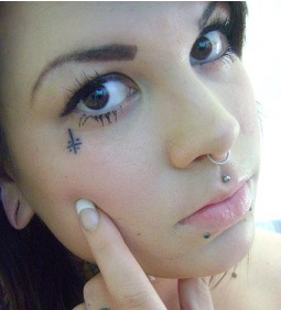 small face tattoos under eye